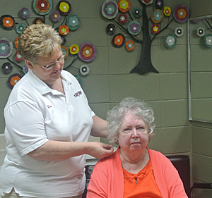 nurse styling patient's hair